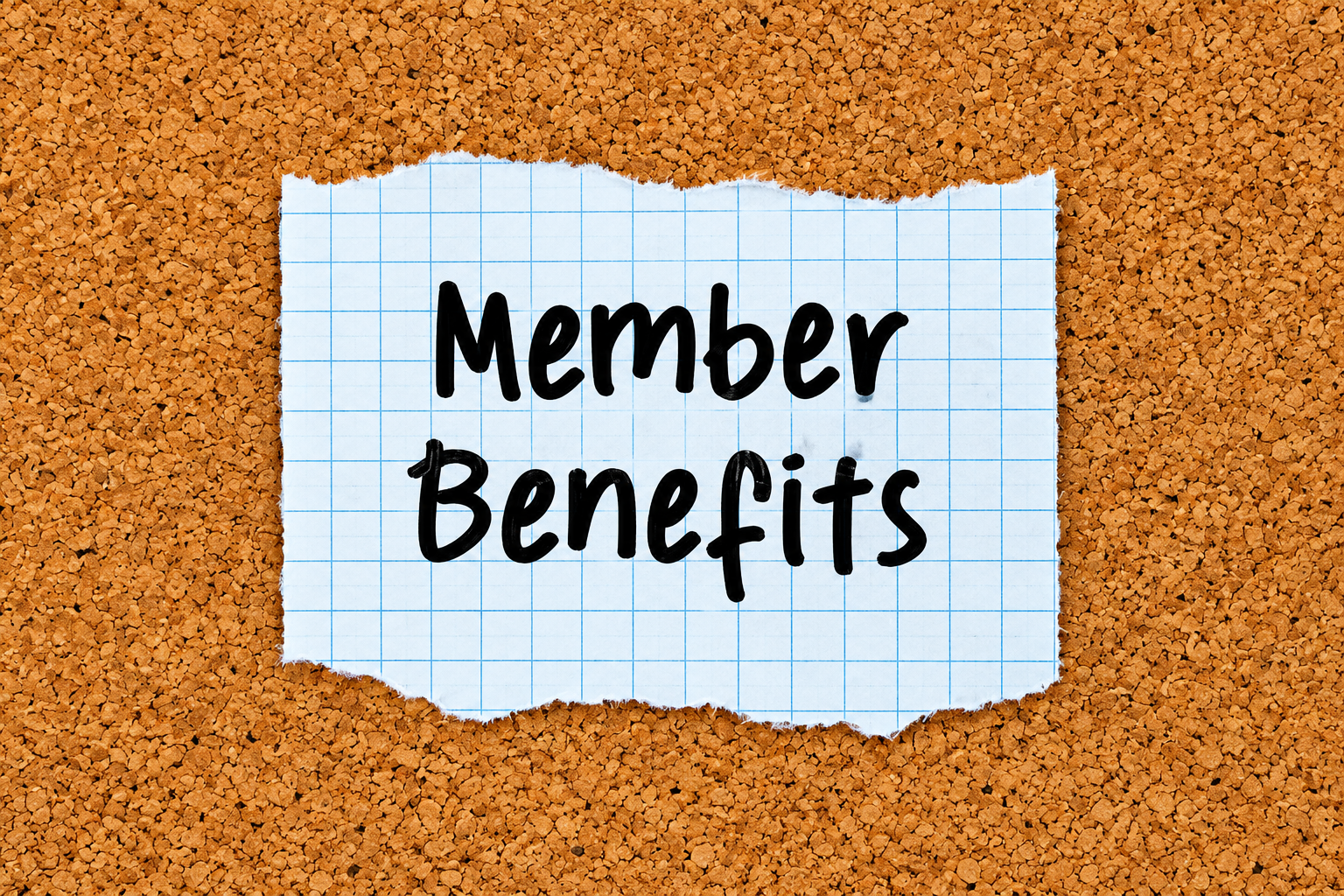 Member Benefits written on graph paper on a corkboard